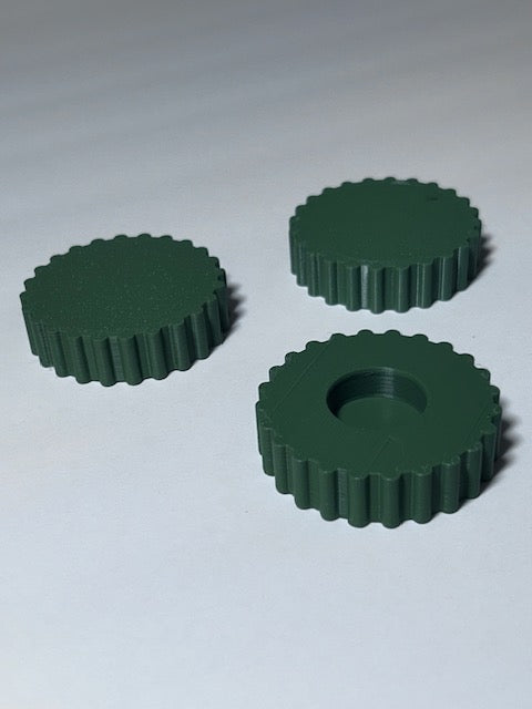 Three olive green BR LevelGrip 50 oversized benchrest leveling knobs